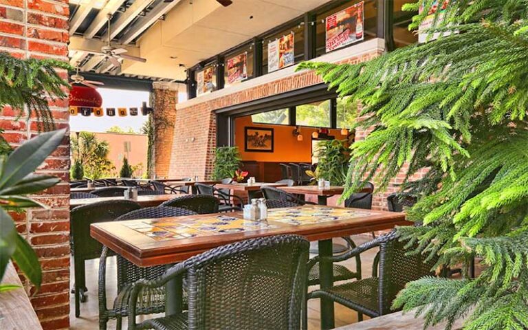 patio dining with red brick columns and plants at peppers cocina mexicana tequila bar fernandina beach