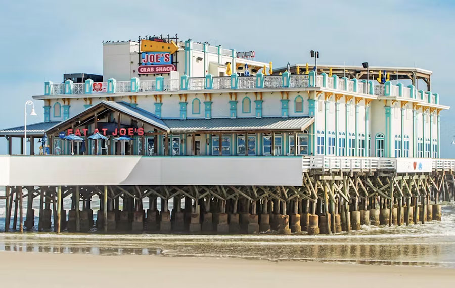 pier building on beach with joes crab shack at main street pier daytona beach