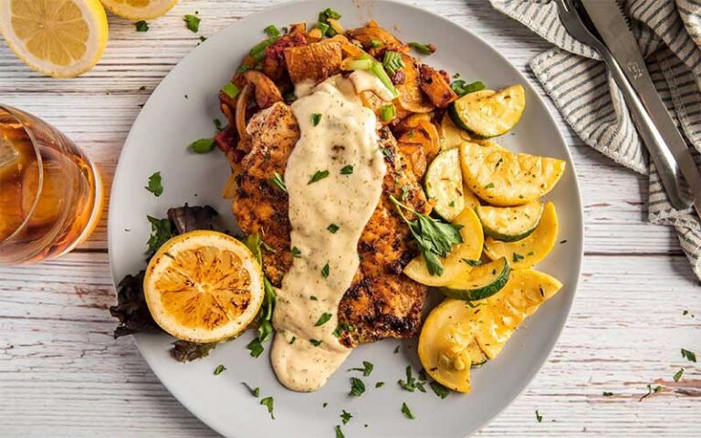 platter of fish fillets with gravy and lemon at sandbar amelia island fernandina beach