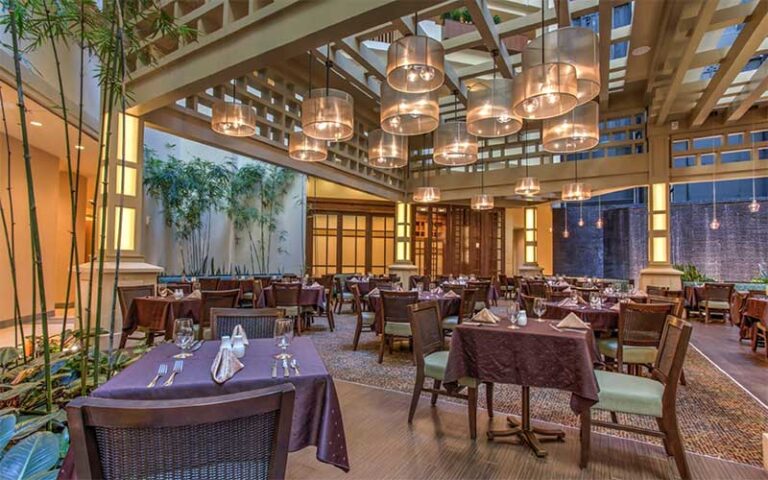 restaurant interior with chic lighting and tables at embassy suites by hilton orlando lake buena vista south kissimmee