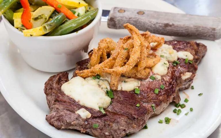 rib steak entree with sides at salty pelican bar grill fernandina beach amelia island