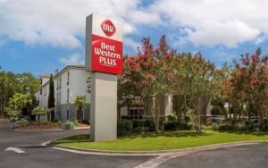 roadside hotel with parking trees and sign at best western plus tallahassee north hotel