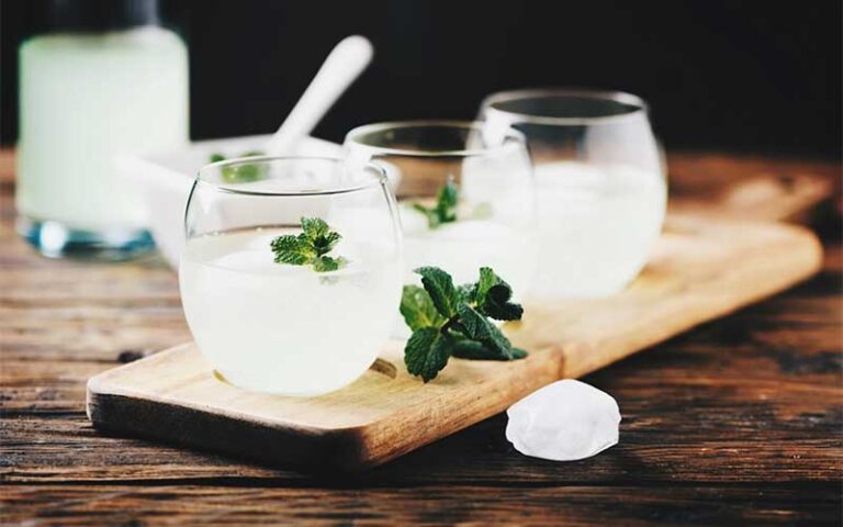 row of cocktails with mint garnish at sajoma latin fusion kissimmee