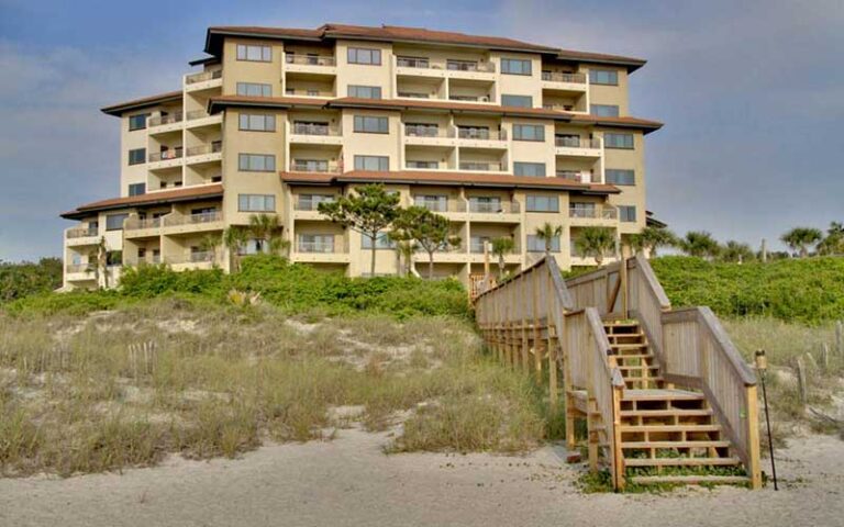 sandcastles villas building with boardwalk from beach at the villas of amelia island fernandina beach