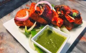 seasoned meat with onion and green sauce at essence of india tallahassee
