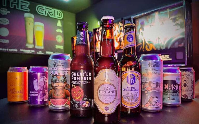 selection of beers on table at the grid arcade pensacola