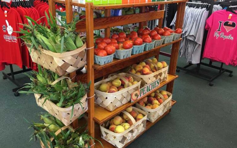 shelf of fruit baskets with clothes racks at elis orange world kissimmee