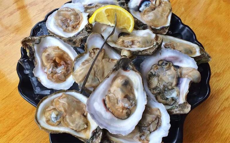 shelled oysters and lemon on platter at crabby bills st cloud kissimmee