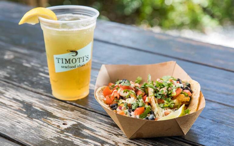 shrimp tacos and drink on patio table at timotis seafood shak fernandina beach amelia island