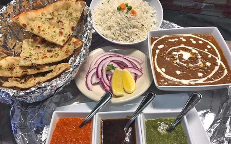 spread of indian cuisine naan biryani rice at essence of india tallahassee