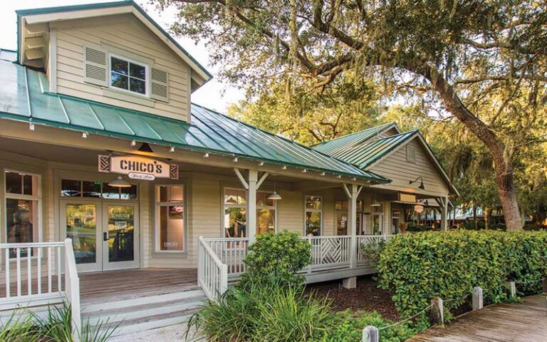 store exterior with chicos sign and porch at the shops at omni amelia island resort