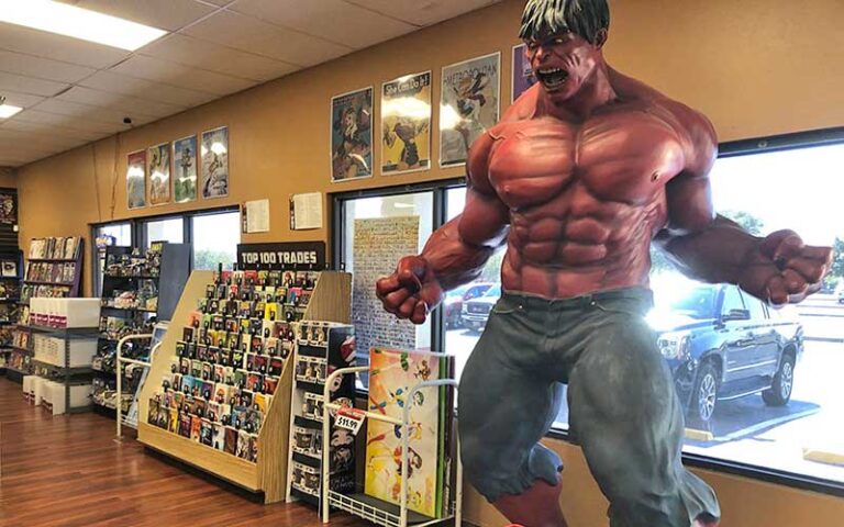 store interior with racks and red hulk statue at coliseum of comics kissimmee