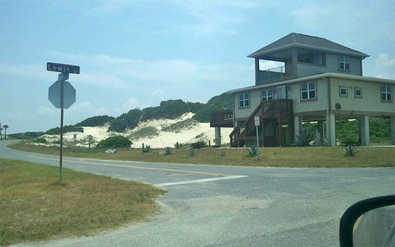 street corner on beach with dunes and house at american beach amelia island