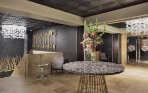 stylish lobby with decor and restaurant entrance at hotel duval autograph collection tallahassee