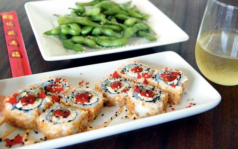 sushi roll with edamame and wine at salt life food shack fernandina beach