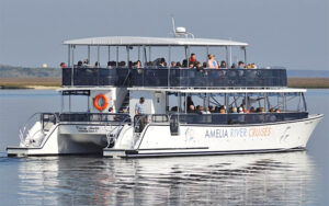 tour boat on bay with reflection at amelia river cruises charters fernandina beach