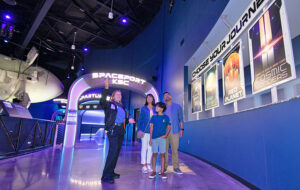 tour guide with family in spaceport attraction at kennedy space center visitor complex