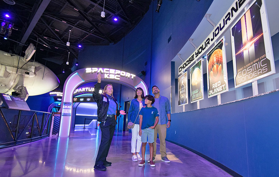 tour guide with family in spaceport attraction at kennedy space center visitor complex