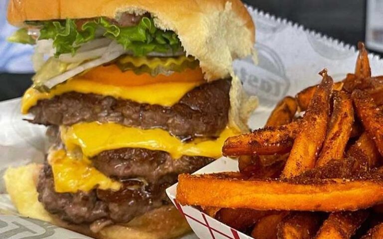 triple deluxe burger with sweet potato fries at tastys fresh burgers fernandina beach