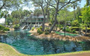 water feature with house and cascades at island falls adventure golf amelia island