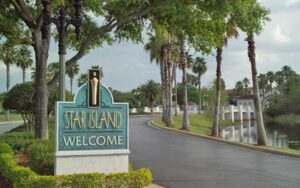 welcome sign on driveway across lake at star island resort spa kissimmee