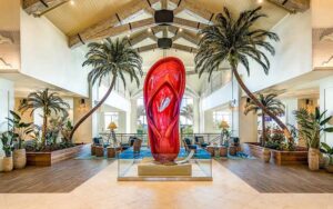 wood themed lobby with atrium and giant red flip flop at margaritaville resort orlando kissimmee
