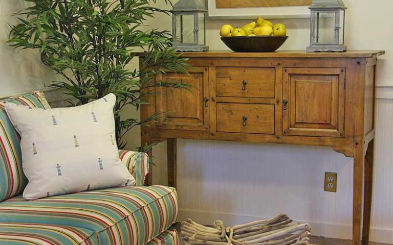 wooden furniture with sofa and decor at palmetto walk shopping village amelia island