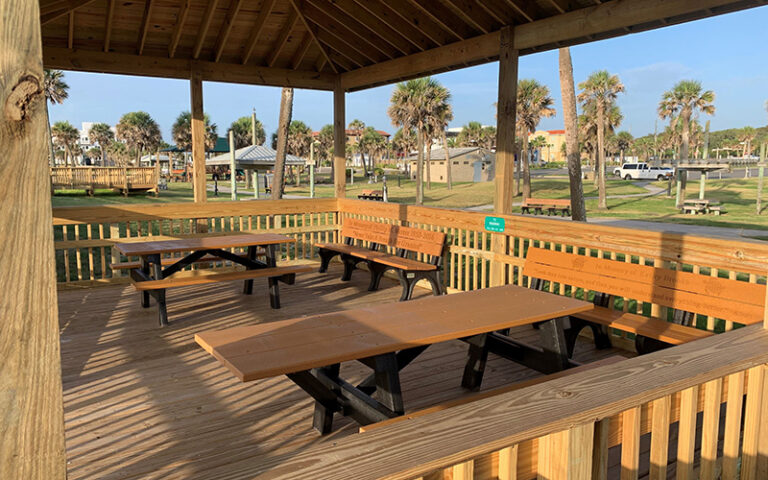 wooden picnic table pavilion with park area at main beach park fernandina amelia island