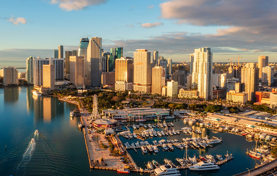 aerial view of downtown miami with warm sunrise marina and boats