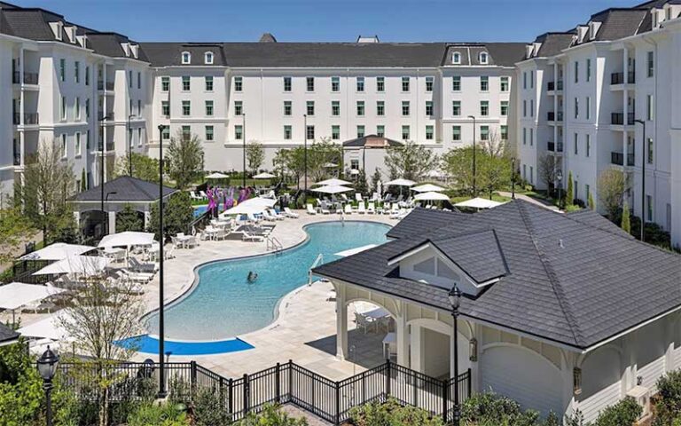 aerial view of hotel courtyard with curvy pool at the riding academy hotel ocala