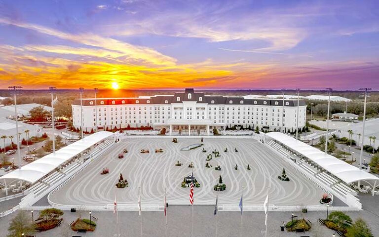 aerial view of hotel with arena and sunset sky at the equestrian hotel ocala