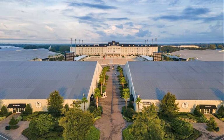 aerial view of stately complex with arenas and cloudy sky at world equestrian center ocala