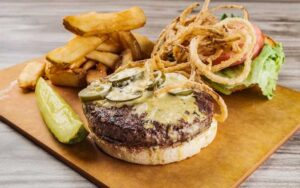 angus burger with sides at horse hounds restaurant ocala