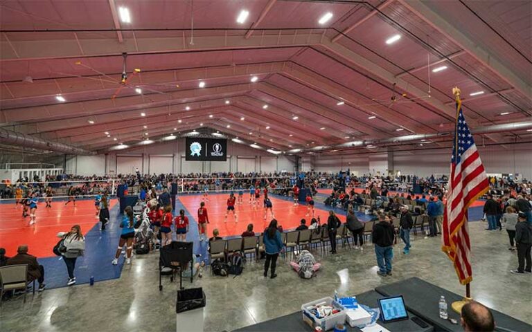 arena interior with multiple volleyball courts tournament at world equestrian center ocala