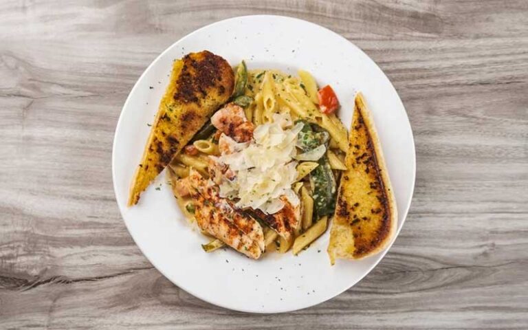 chicken penne pasta with bread at horse hounds restaurant ocala