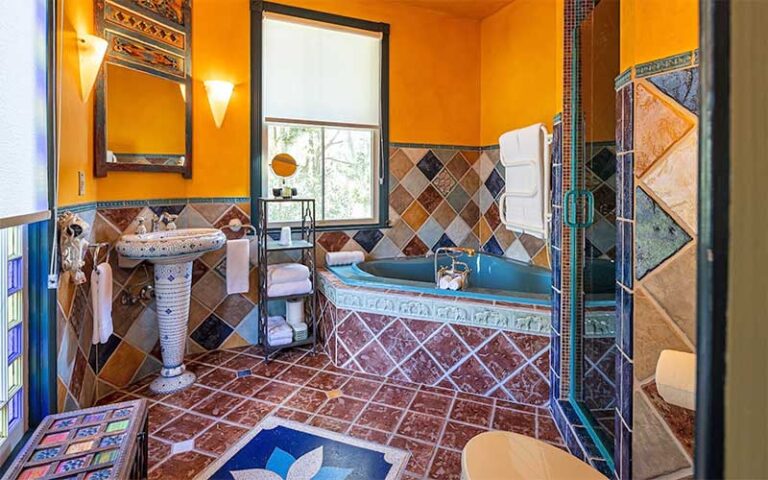 colorful tiled bathroom with period design at seven sisters ocala