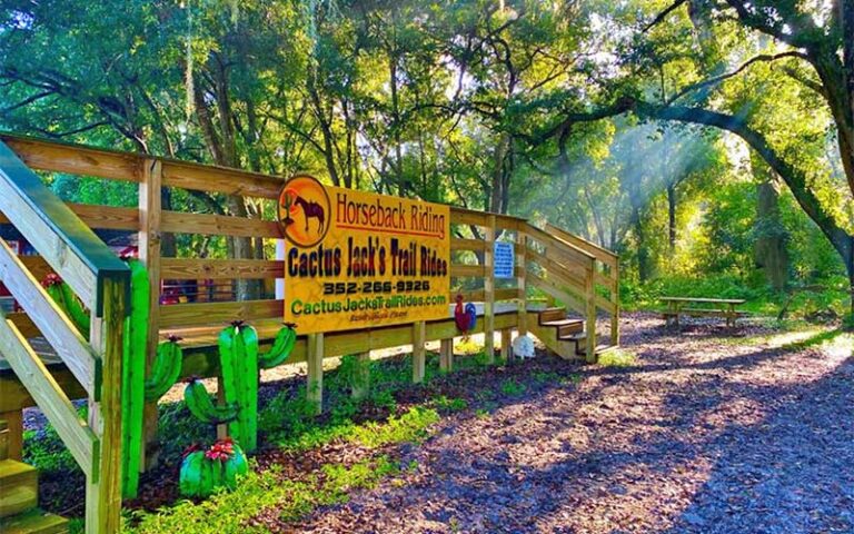 corral with fence and sign at cactus jacks trail rides ocala