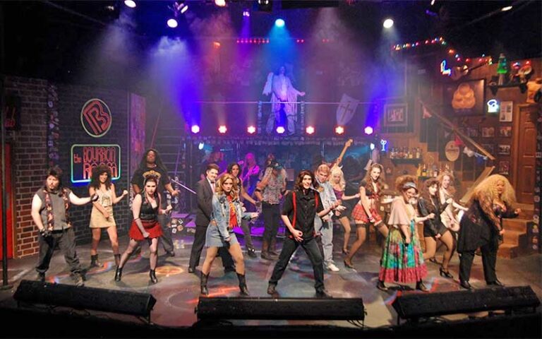 dancing cast of characters on stage for rock themed production at theatre tallahassee