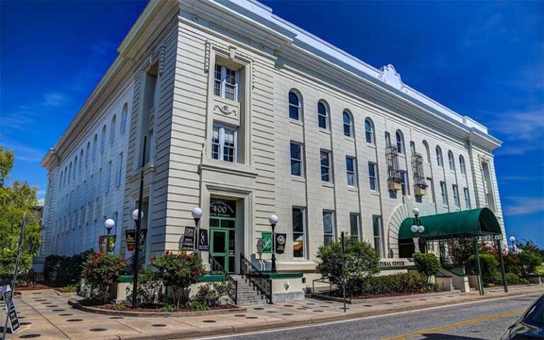 daytime exterior of street corner building at pensacola little theatre