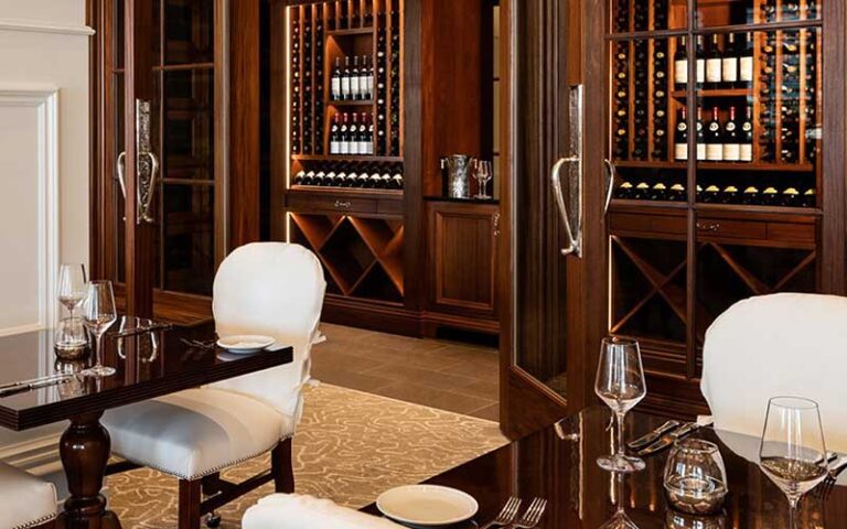 dining area with wooden wine cabinets at stirrups restaurant ocala