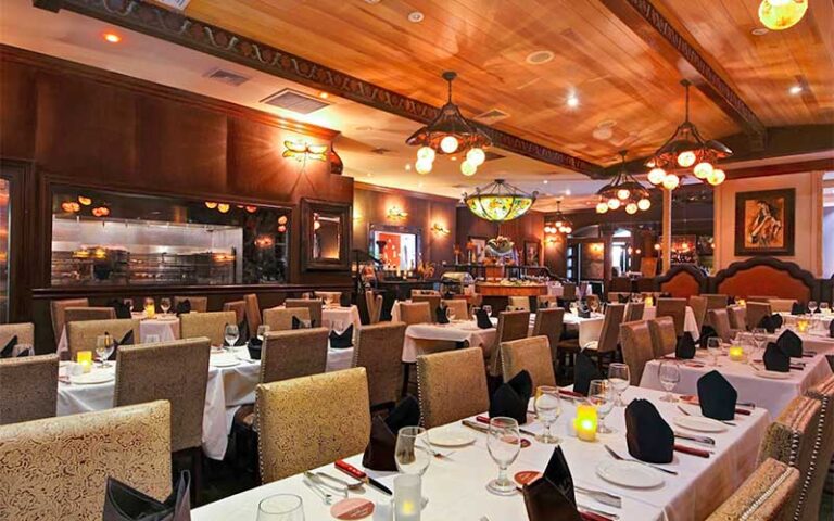 dining room interior with long tables and wood accents at ipanema brazilian steak house ocala