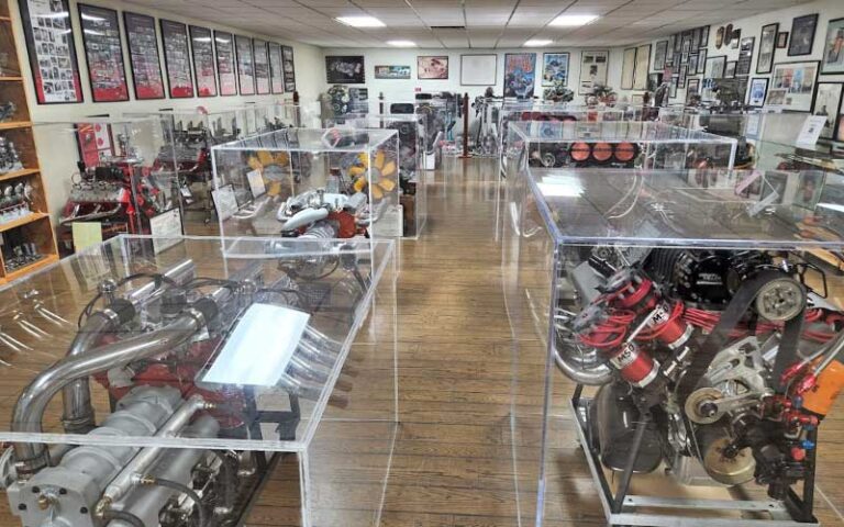 exhibit room with engines in cases at don garlits museum of drag racing ocala