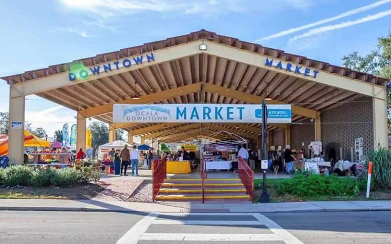 exterior entrance from street of covered pavilion with signs at ocala downtown market