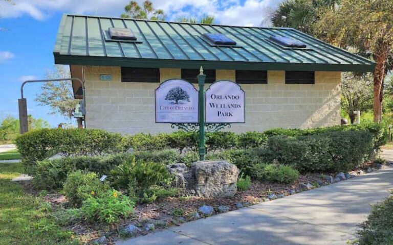 facilities near gate with sign at orlando wetlands christmas