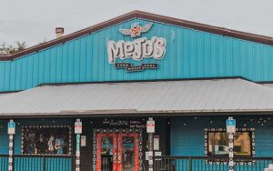 front entrance of restaurant with painted windows at mojos ocala