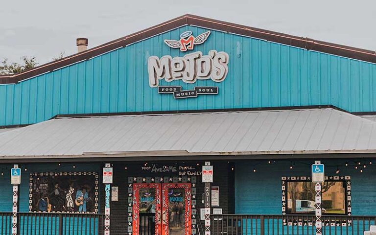 front entrance of restaurant with painted windows at mojos ocala