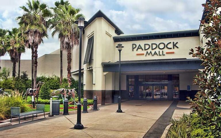 front entrance with horse sculptures and trees at paddock mall ocala