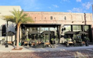 front exterior of brick restaurant with patio seating at ivy on the square ocala