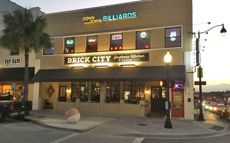 front exterior of downtown building at twilight at brick city southern kitchen ocala