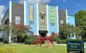 front exterior of science museum with horse sculpture at discovery center ocala